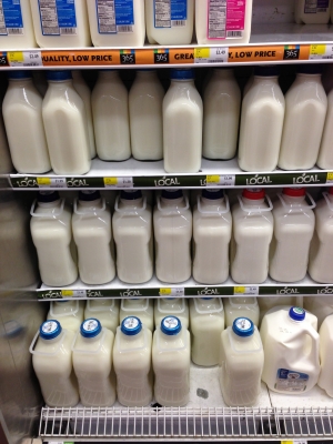 Glass bottled milk in US wholefood store: red top is organic and full-fat